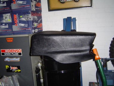 The custom seat has denser foam and extended tongue to better match up to the fuel tank.